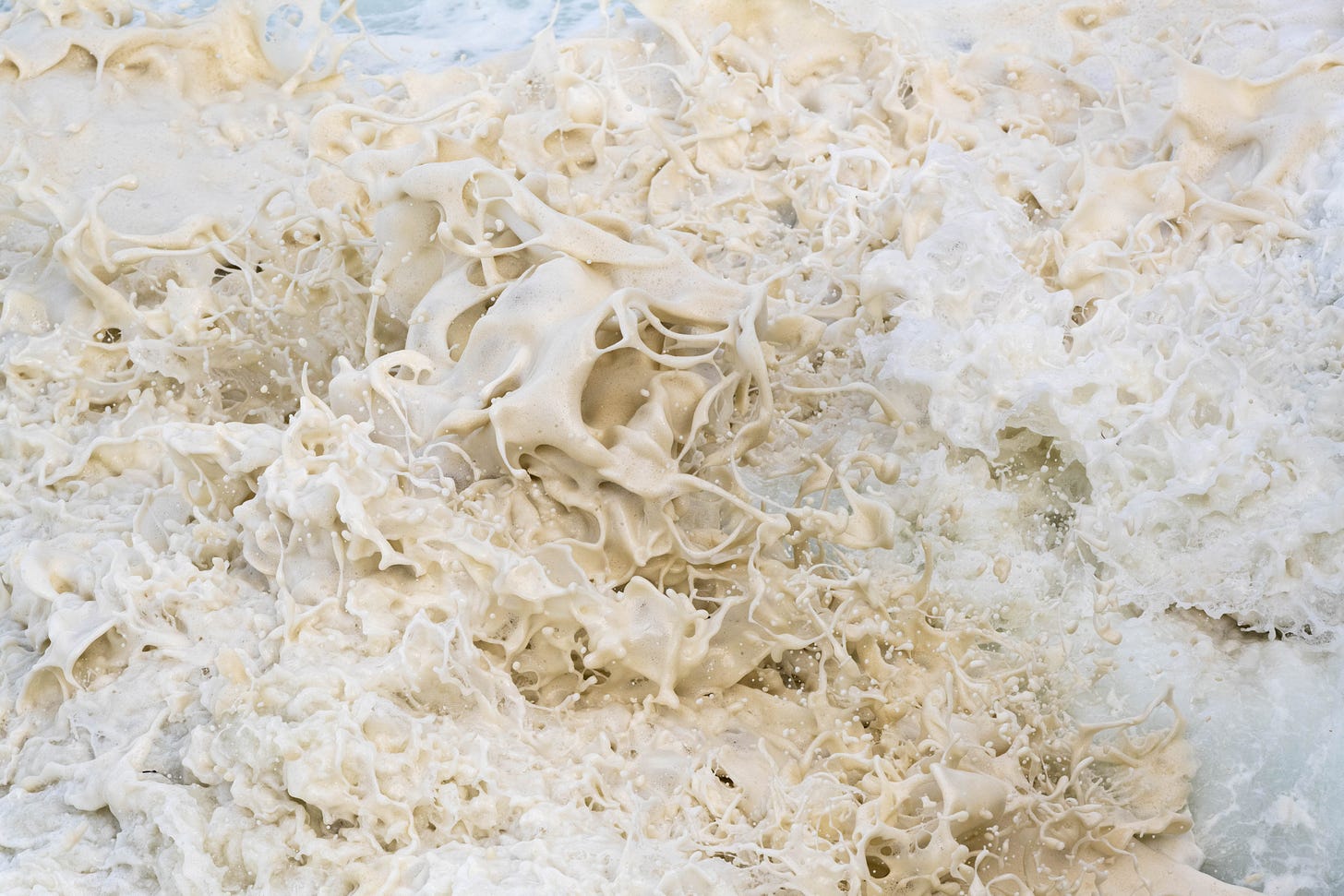 white foam at the edge of a rough sea