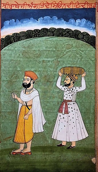 File:Guru Nanak with Bhai Lehna, who is getting dirtied by carrying weeds overhead.jpg