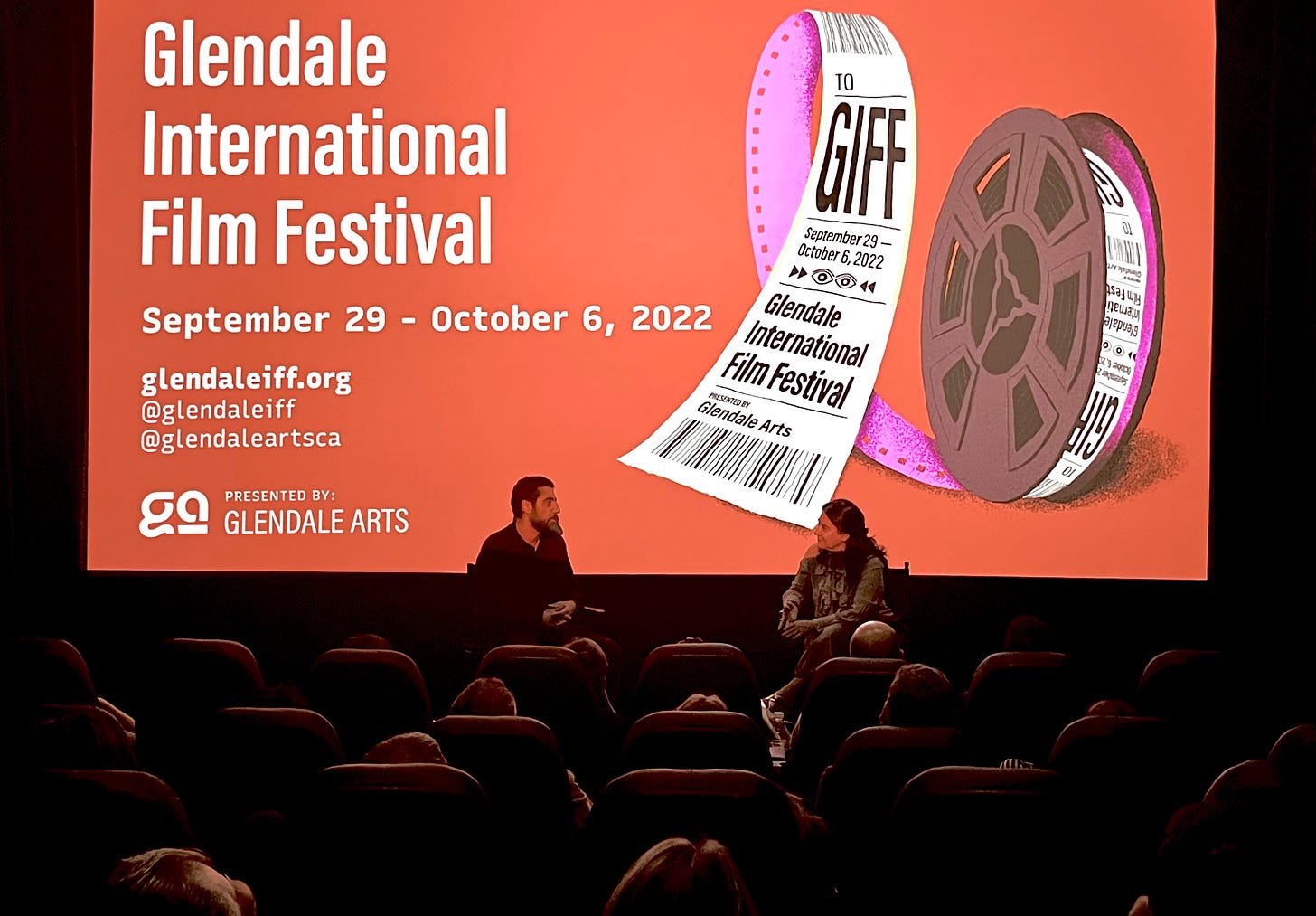 Photo of Bianca Bagatourian holding a panel discussion at the Glendale International Film Festival, 2022, with filmmaker Von Kochar for his feature film, ITALIAN FOR TRAVELERS