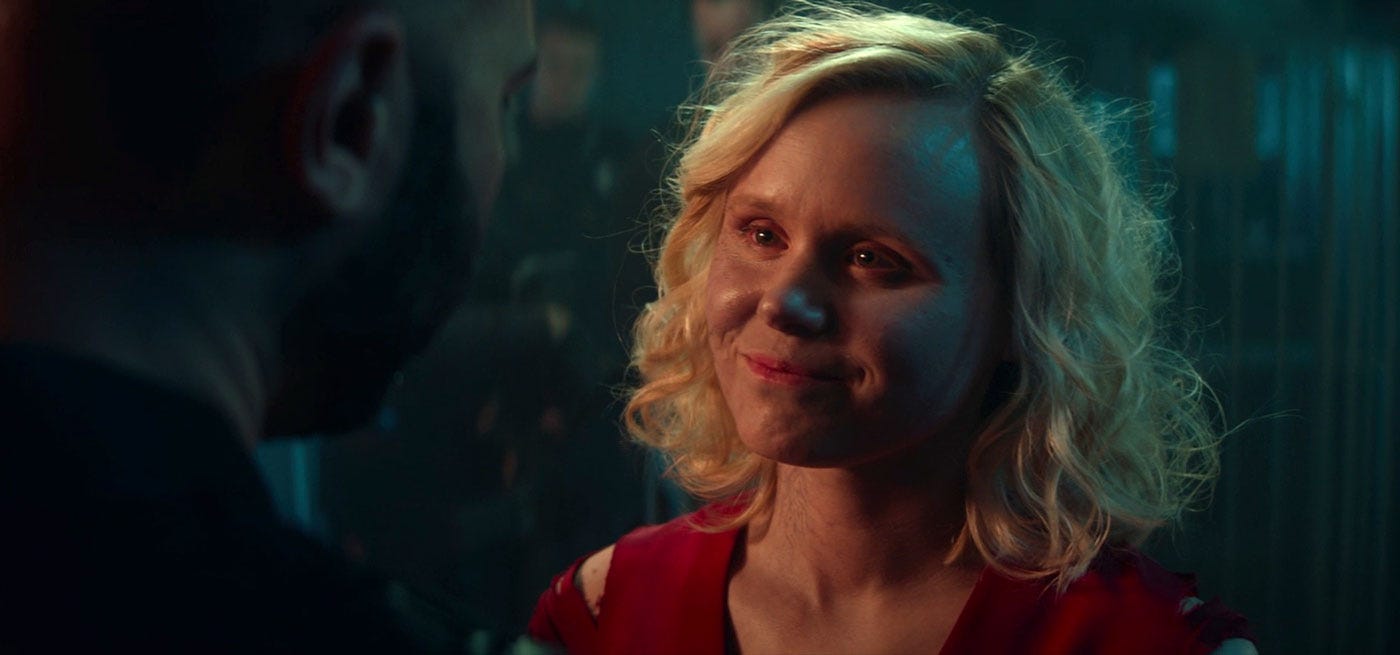 This image shows the Borg Queen-controlled Agnes Jurati (played by Alison Pill) smiling at a Spearhead Operations mercenary (played by Charles Maceo) just before she assimilates him into her new Borg Collective. The mercenary appears in one-quarter profile. This image shows the Borg Queen-controlled Agnes Jurati (played by Alison Pill) smiling at a Spearhead Operations mercenary (played by Charles Maceo) just before she assimilates him into her new Borg Collective. The mercenary appears in one-quarter profile.