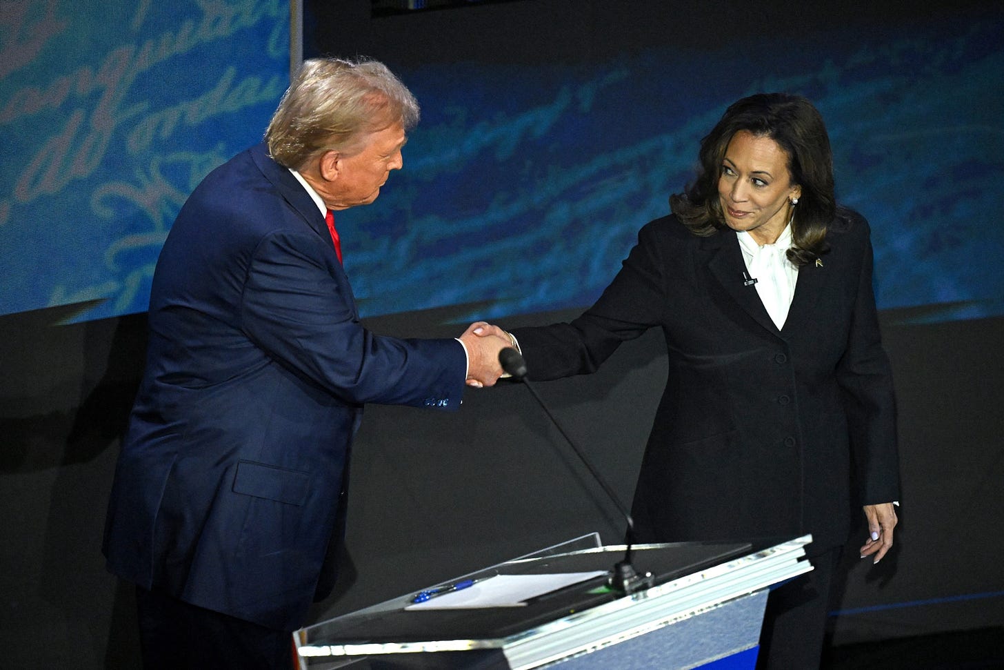 PHOTO: Vice President and Democratic presidential candidate Kamala Harris (R) shakes hands with former President and Republican presidential candidate Donald Trump during a presidential debate in Philadelphia, on Sept. 10, 2024.