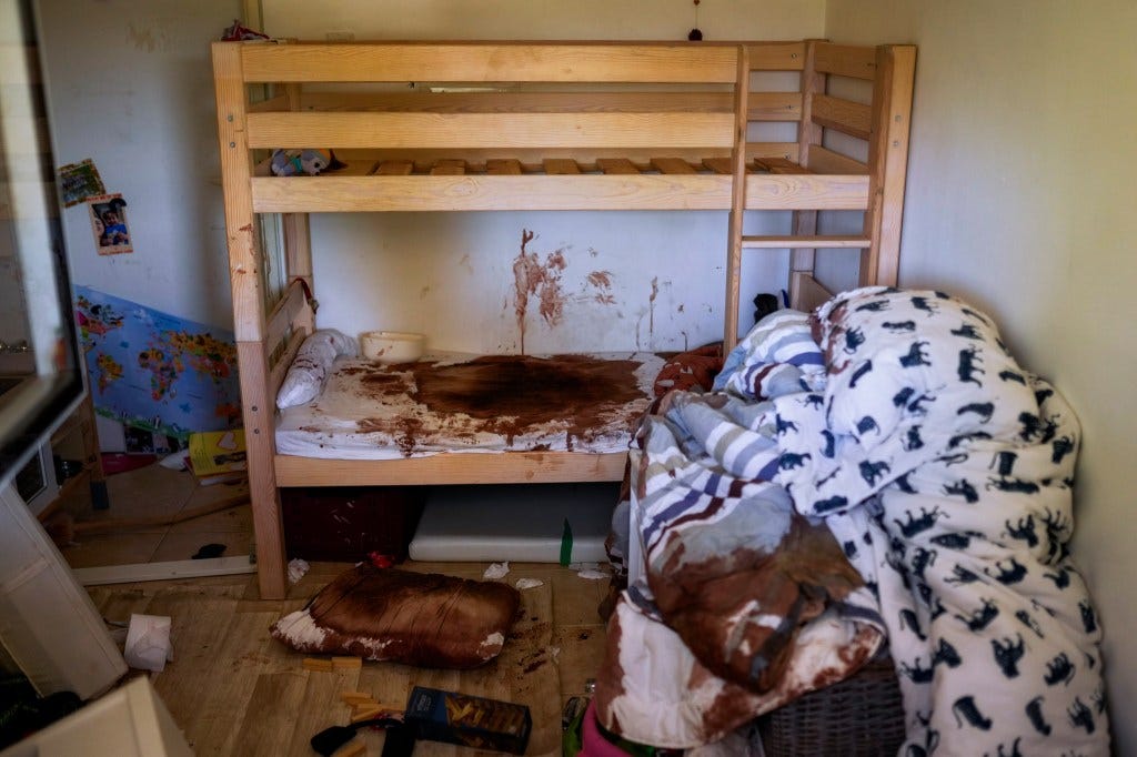 Blood is seen splattered in a child's room following Hamas' attack in Kibbutz Nir Oz, Israel.