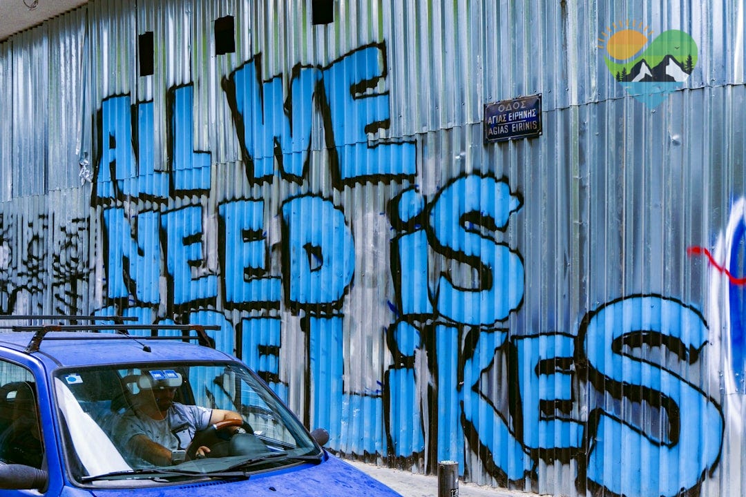 vehicle beside wall with graffiti