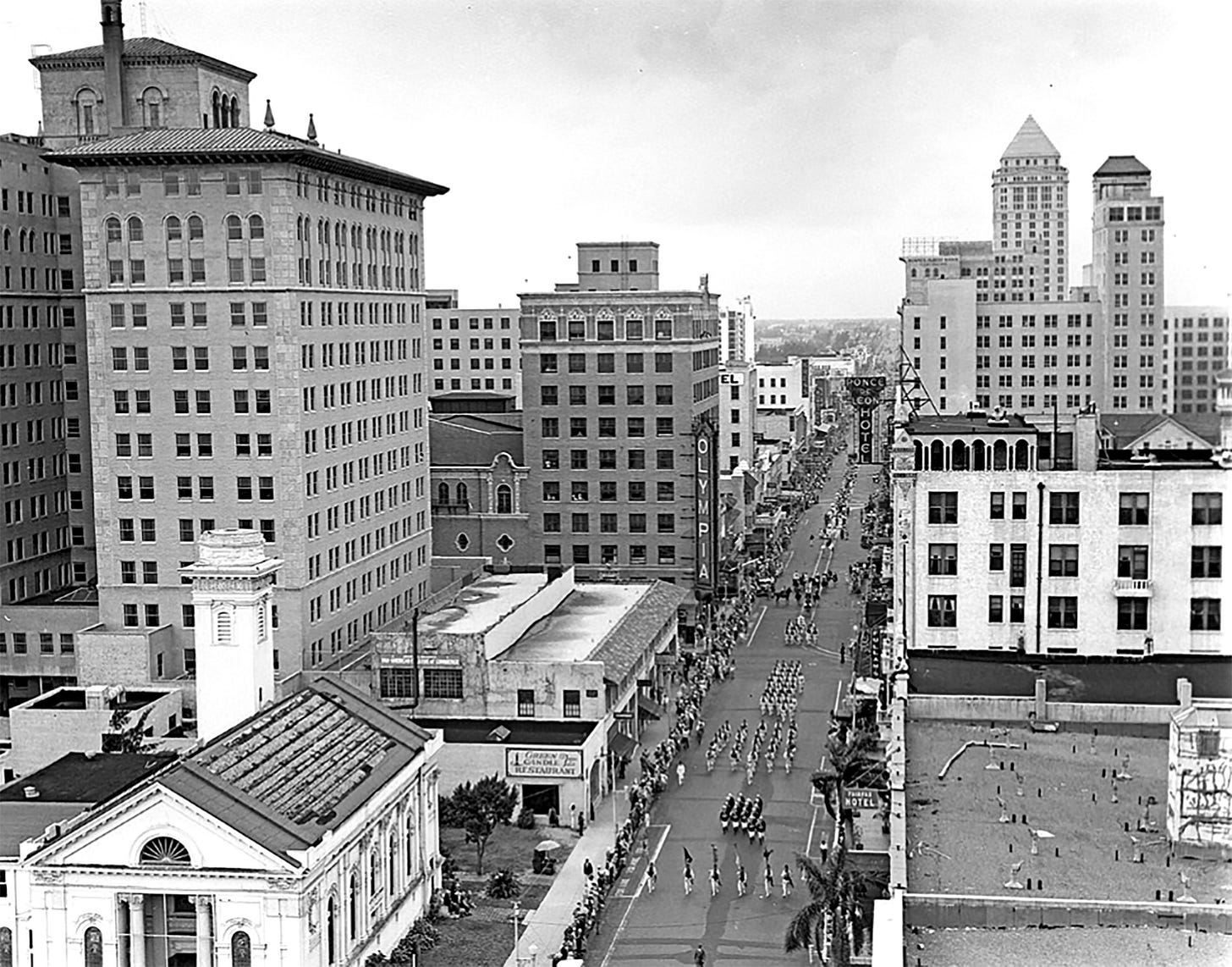 Figure 1: Parade on Flagler Street on April 14, 1933, celebrating Pan American Day. The Tatum building can be seen on the left in front of the Olympia Theater sign. Courtesy of Florida State Archives. Figure 1: Parade on Flagler Street on April 14, 1933, celebrating Pan American Day. The Tatum building can be seen on the left in front of the Olympia Theater sign. Courtesy of Florida State Archives.