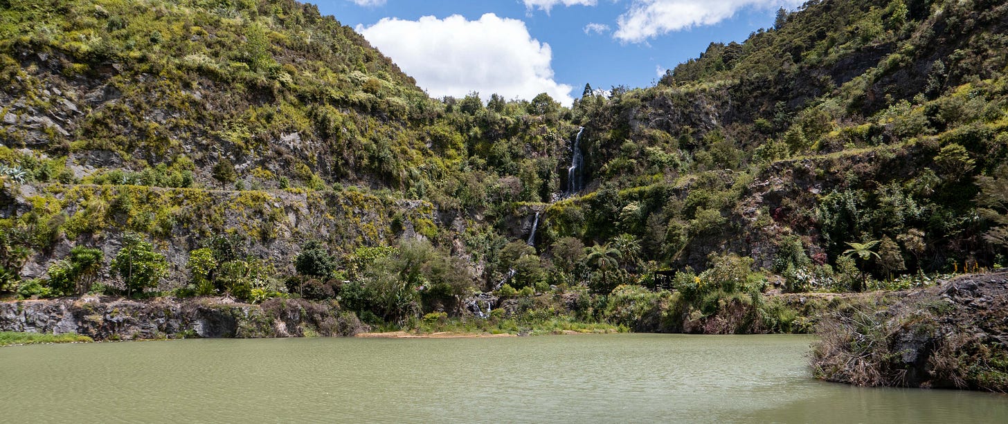 A narrow waterfall dropping into the lake at the quarry gardens.