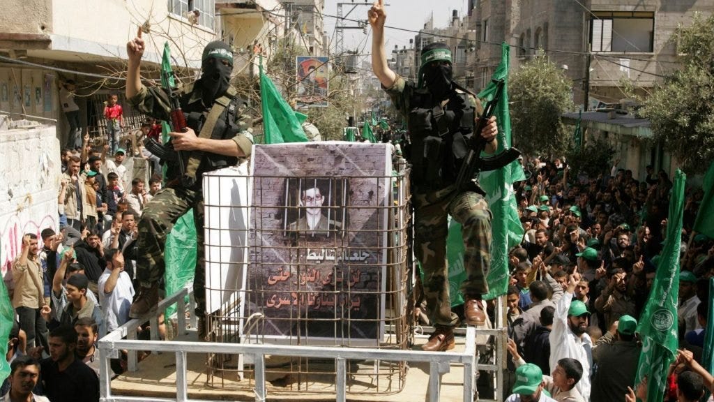 Hamas militants with a picture of Gilad Shalit in Jabalya Gaza in 2007
