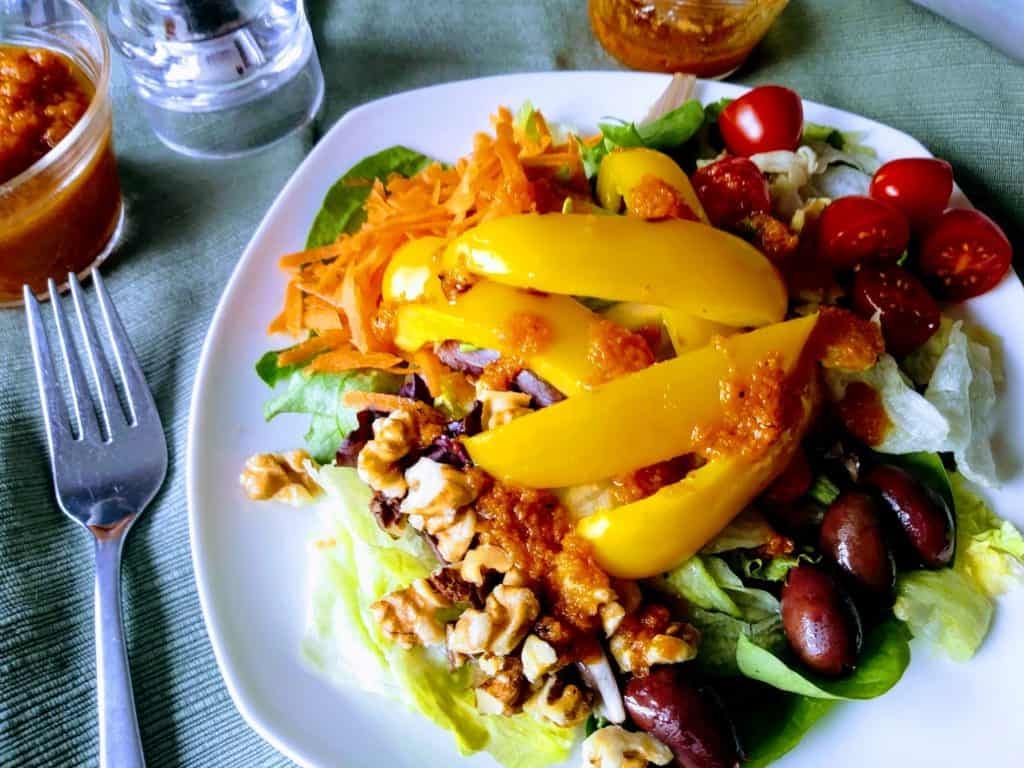 salad with yello peppers and pumpkin salad dressing.