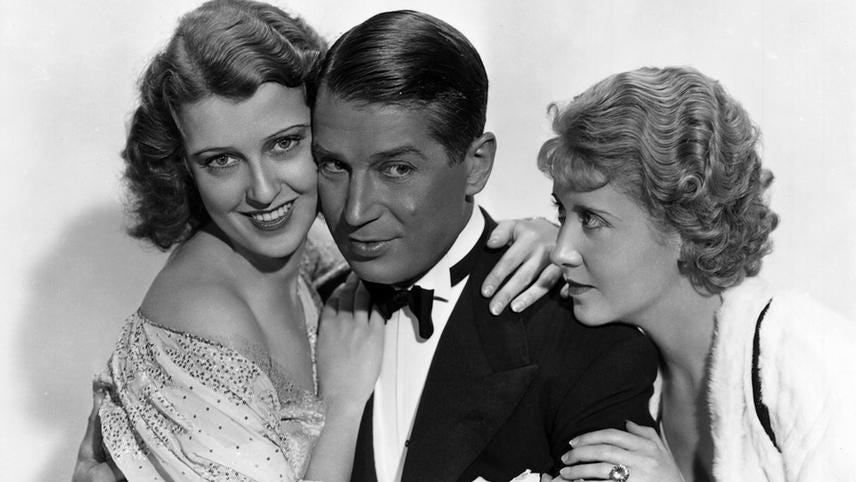 Jeanette MacDonald, Maurice Chevalier, and Genevieve Tobin in a promotional photo for One Hour With You