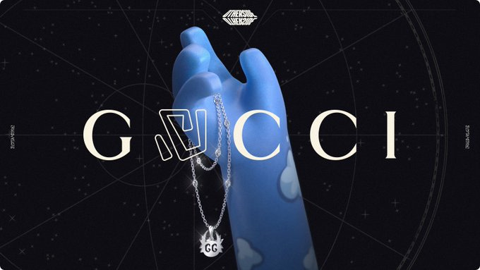 A blue digital hand with four fingers holds a silver necklace with an Interlocking G chain and a Koda-shaped pendant with a GG cut-out in front of a black and white constellation map. On the top, there is the Otherside logo in white and it says Gucci in the middle with the U in an outlined font. On the left and the right there are coordinates. 
