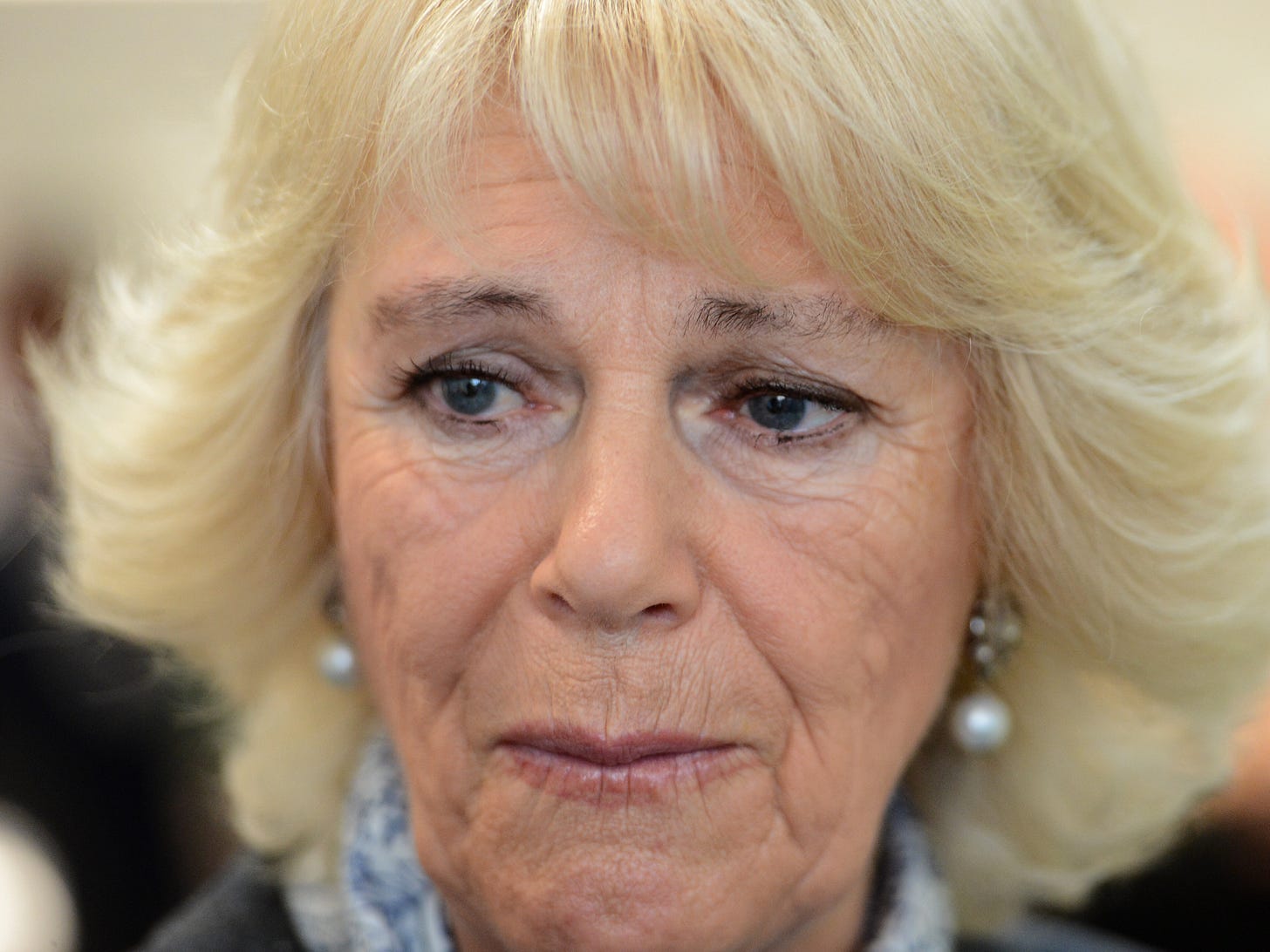Close-up of a sad looking Queen Camilla