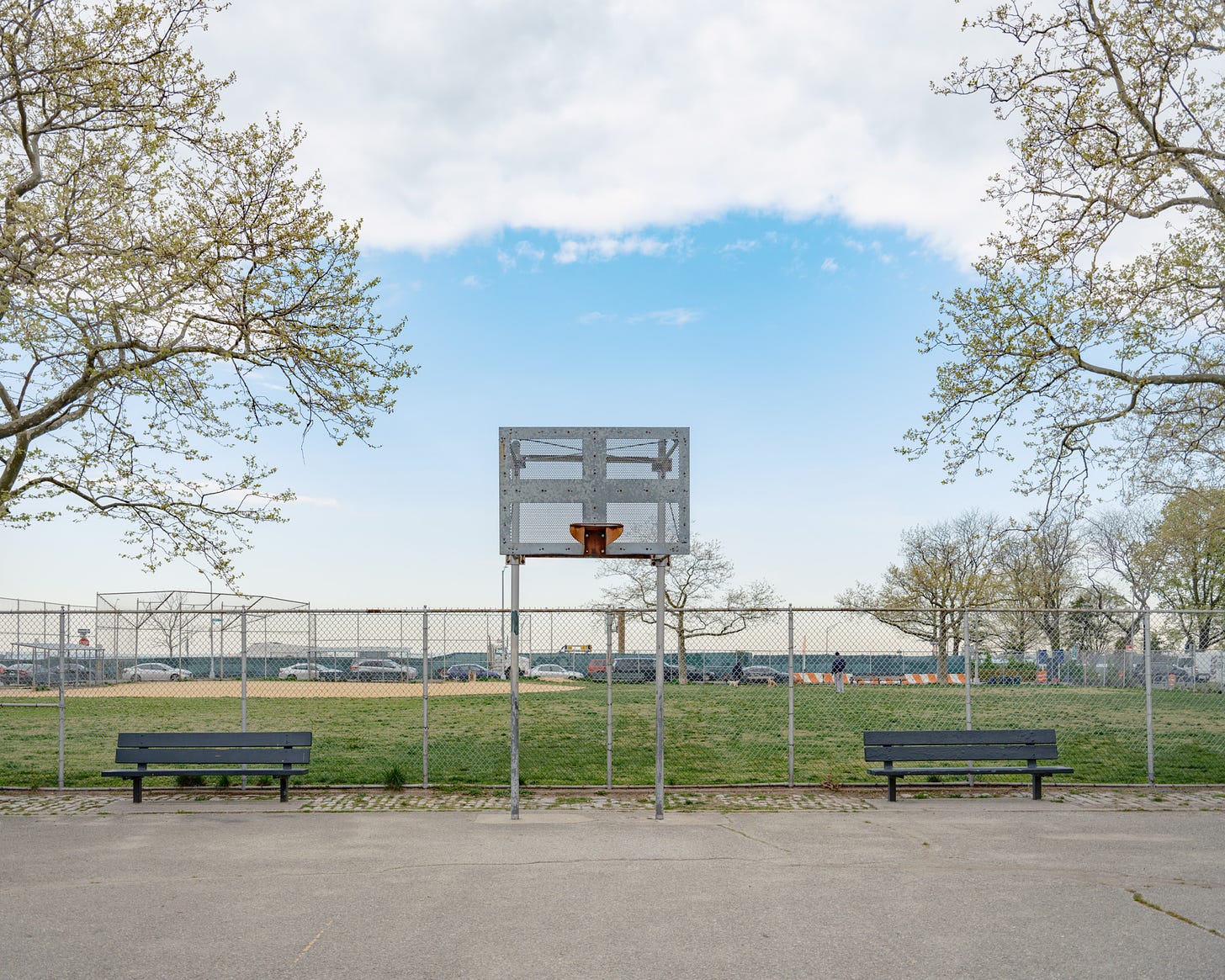 Basketball hoop under blue sky