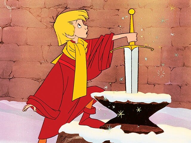 Still from the animated film, The Sword in the Stone. A young blonde boy, Arthur, wears a red cloak and yellow scard. With one hand, he grasps onto the handle of the sword that is stuck in a stone.