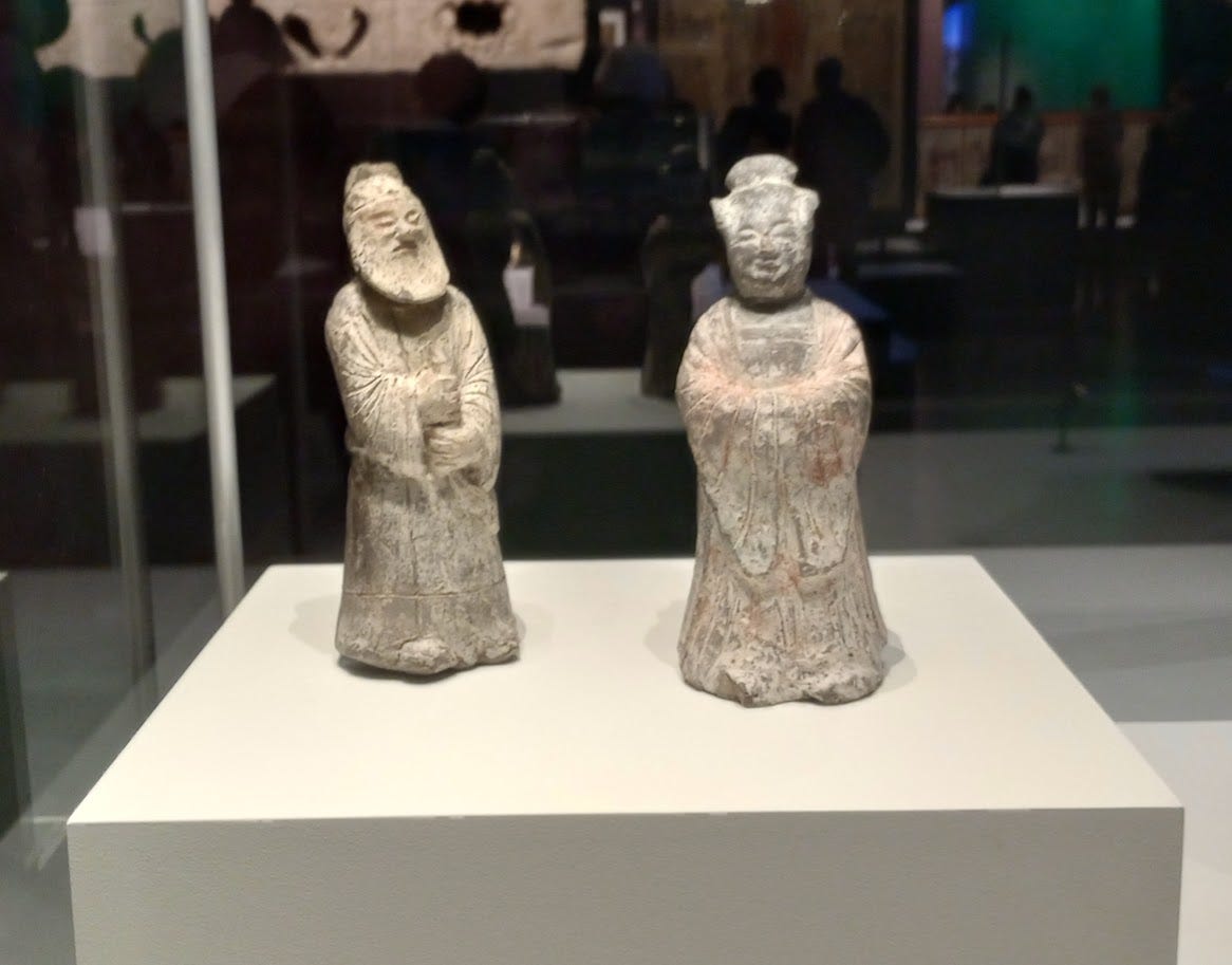 Two clay figures in Chinese dress