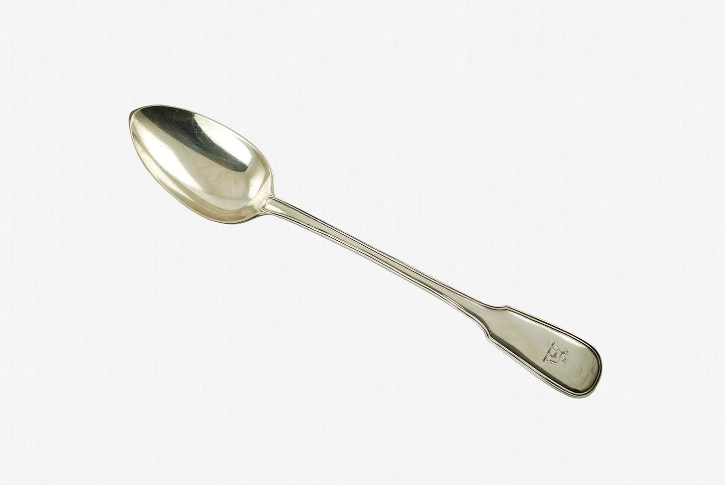 Silver spoon on a white background