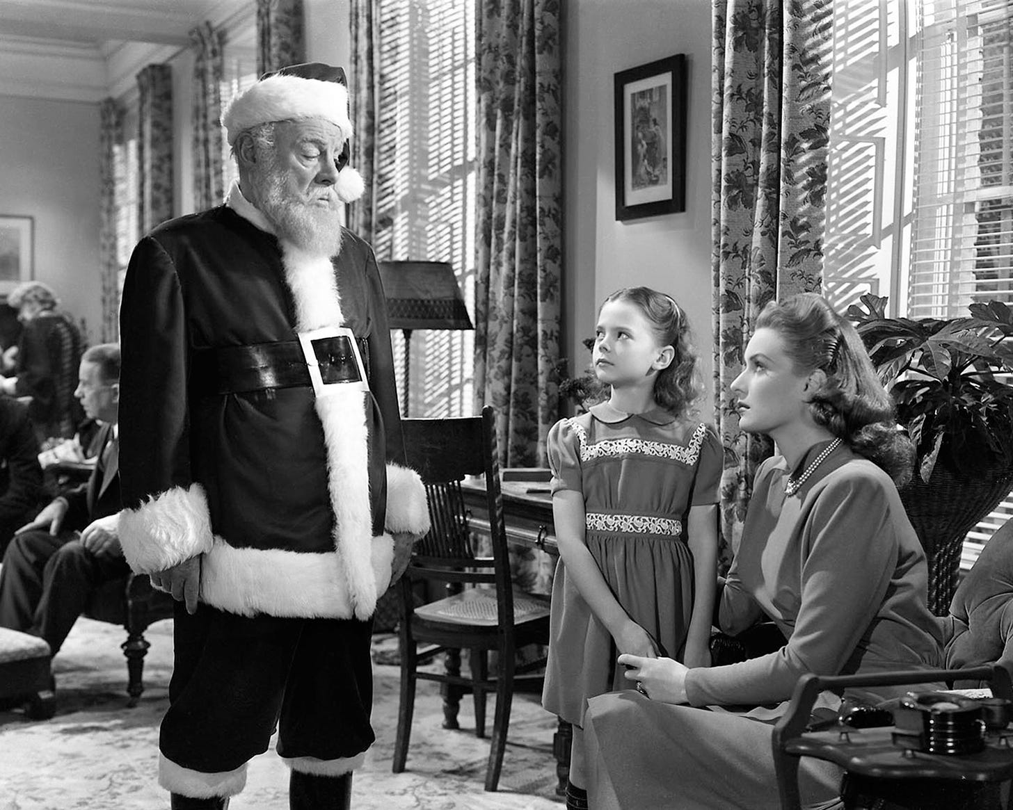 Santa meets up with little Susie and her mom Doris on Christmas Day