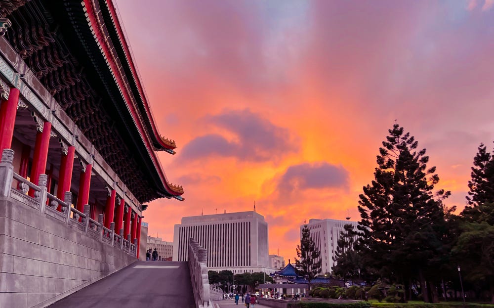 The clouds over the National Concert Hall in Taipei turn bright orange at sunset