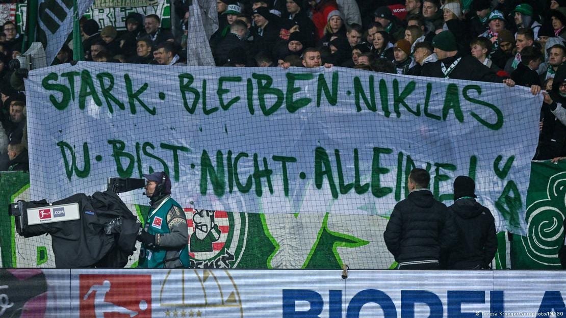Werder Bremen ultra group Ultra Boys hold a banner in support of Niklas Schmidt, which reads 