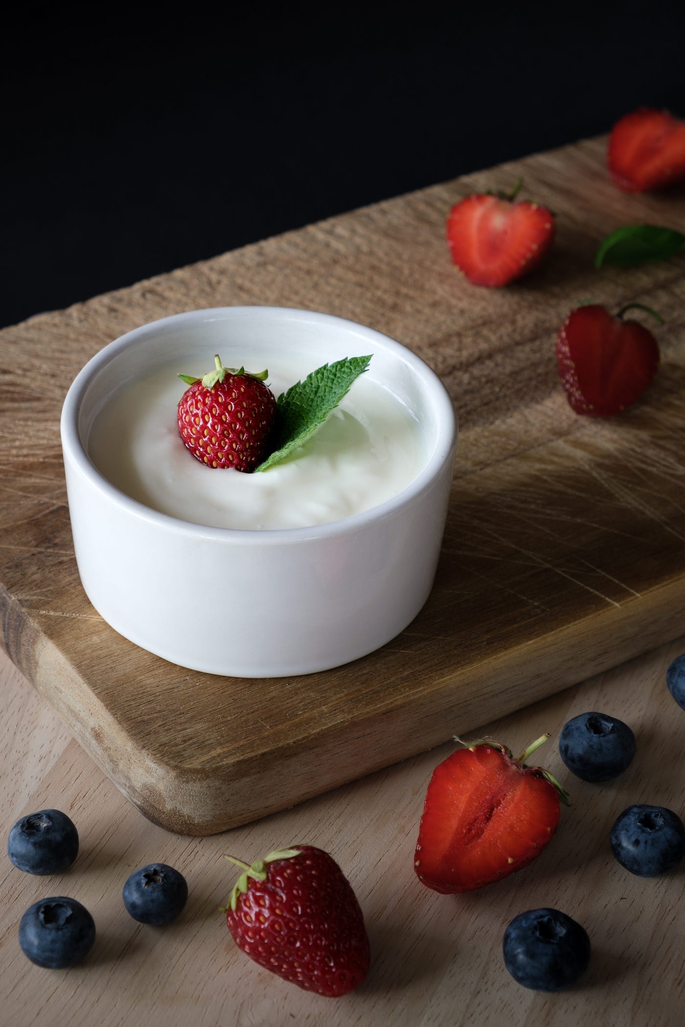 A cup of yogurt with strawberry.