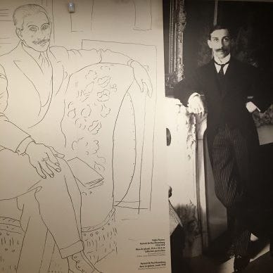 Art dealer Paul Rosenberg stands next to lifesize Picasso drawing of himself.