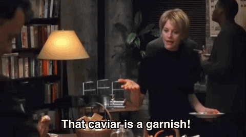 Gif of Meg Ryan saying "That caviar is a garnish!" and Tom Hanks scraping it all off the plate
