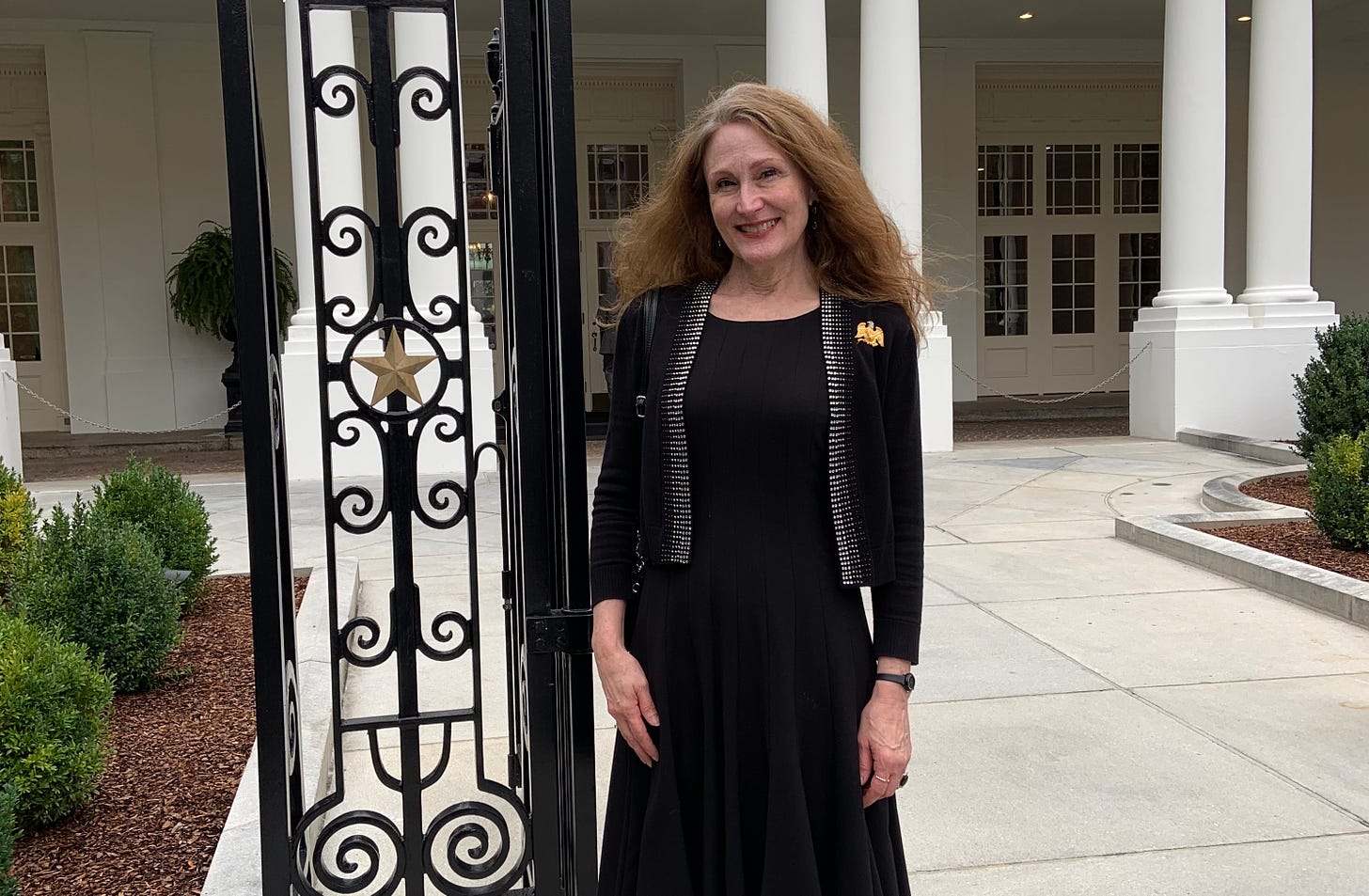 Michelle Gullion, director of collections and research at the National First Ladies Library, stands on the White House grounds on a recent visit to Washington, D.C. 