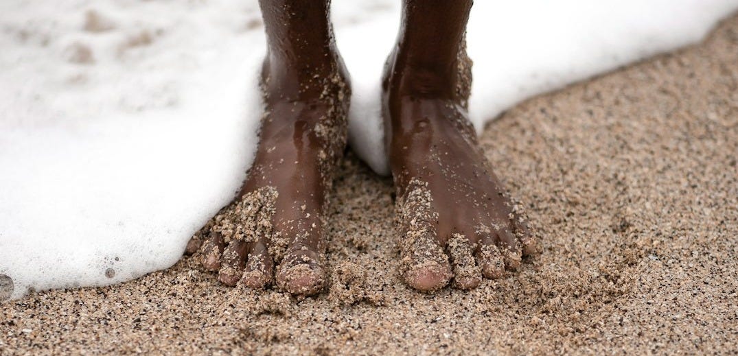 person standing on seashore