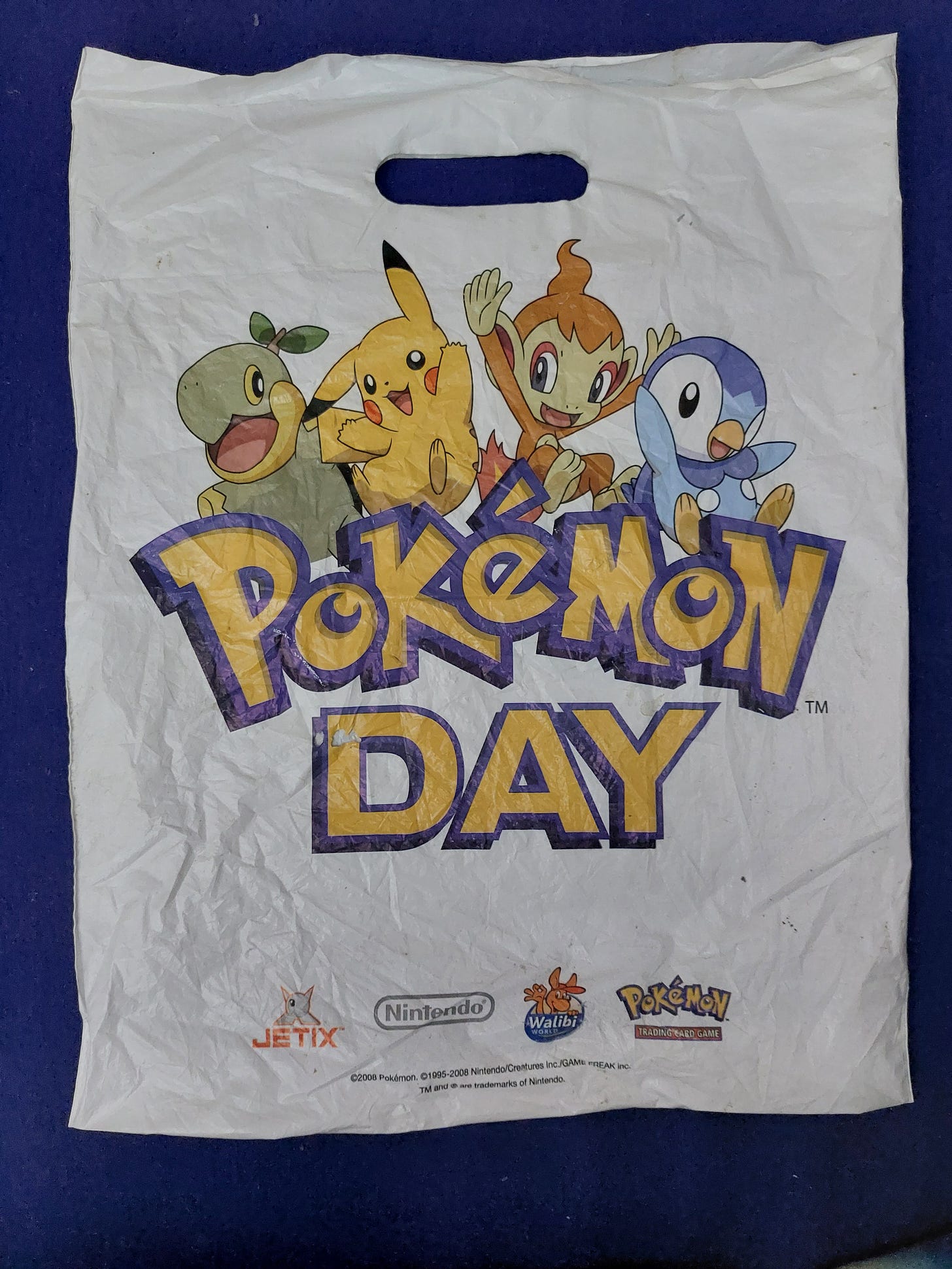 Kimberley’s goodie bag from 2008 that originally contained various items from the Pokémon Day event