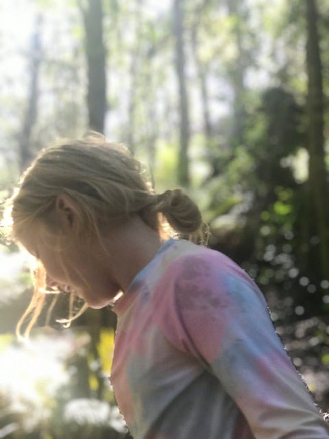 my daughter in state of mindfulness and sunlight
