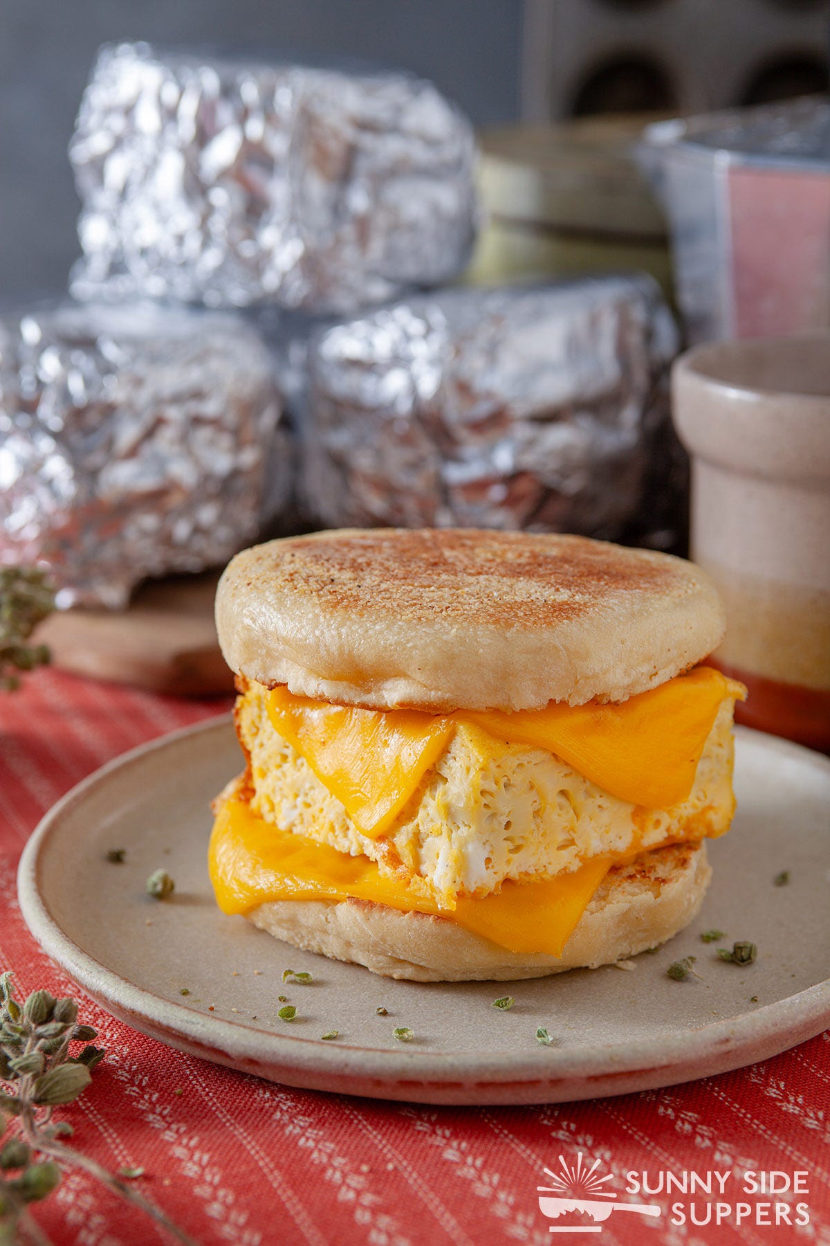 A breakfast sandwich on a plate.