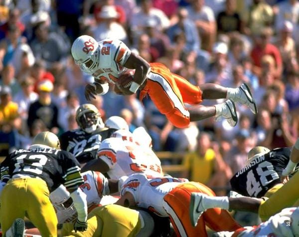 SI Vault on X: "Barry Sanders flies over the Colorado defense:  http://t.co/YGnBwq6" / X