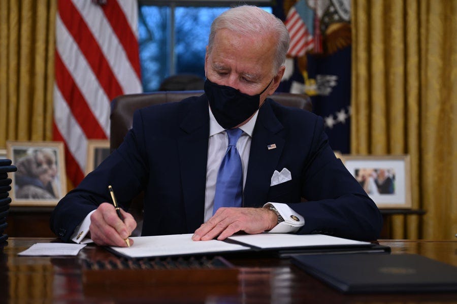 On his first day, Biden gets to work reversing many of Trump's policies