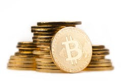 A pile of gold coloured coins A pile of gold coloured coins