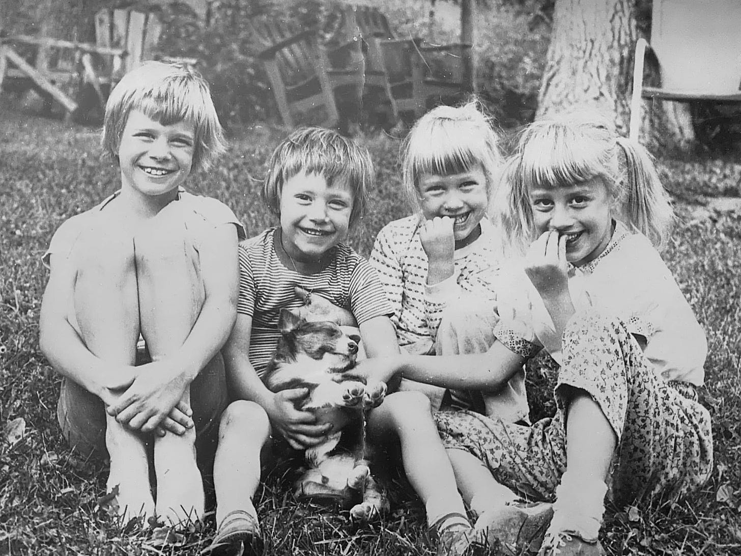 May be a black-and-white image of 3 people, child, blonde hair and people smiling