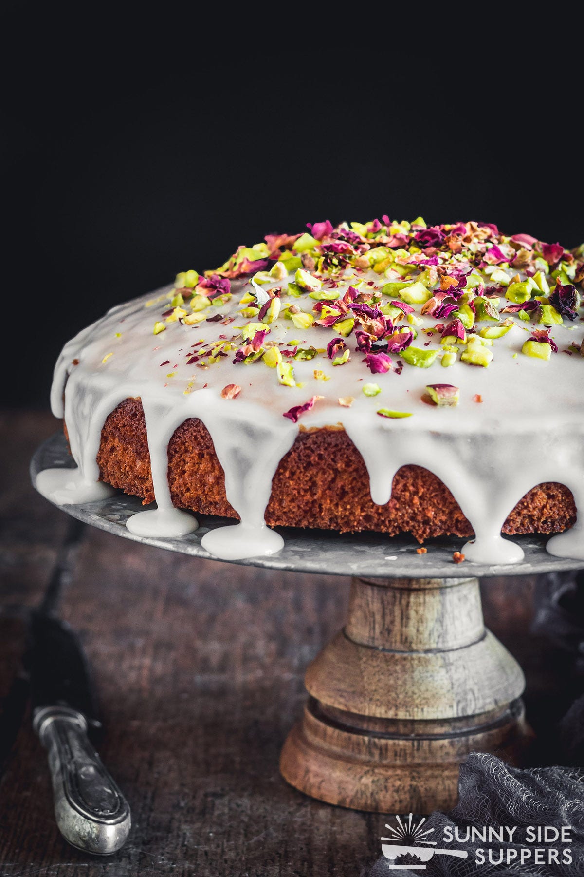 A Persian Love Cake on a cake stand.