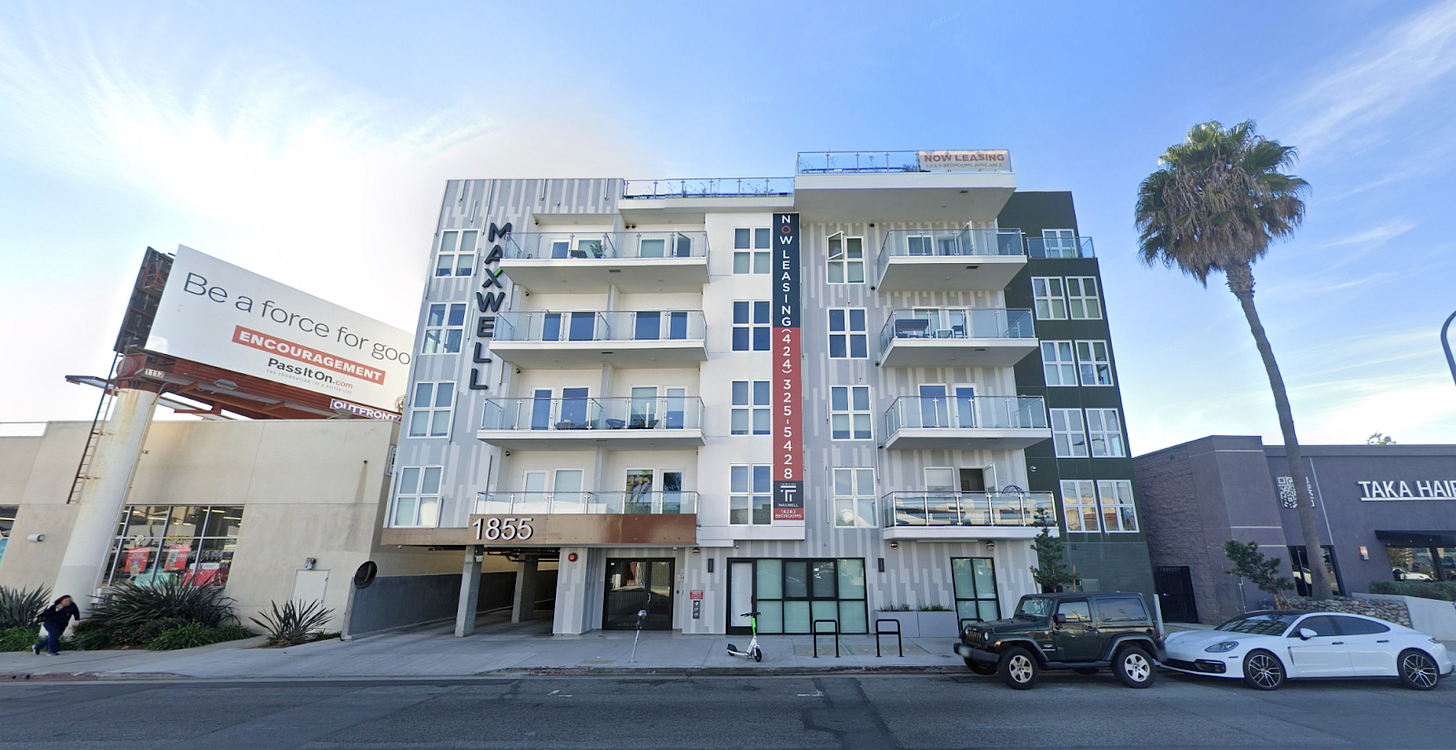 A new five-story apartment building on the same site. The caption is a joke about a nearby billboard that means to say, "Be a force for good."