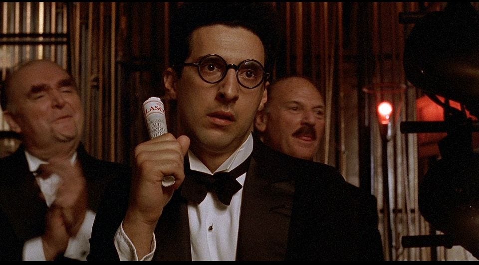 John Turturro in a tux and black bowtie in “Barton Fink” (1991)