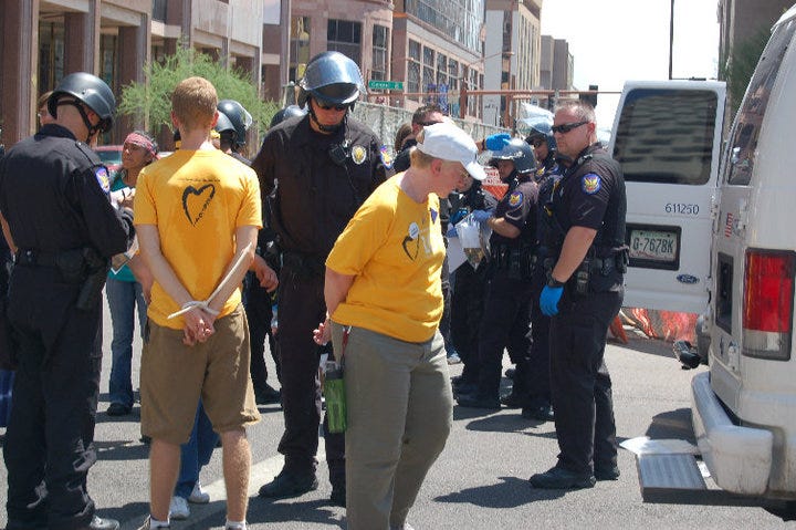 A Phoenix Police officer arresting me while others stand around