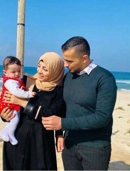 A couple with their toddler daughter on the beach in Gaza.