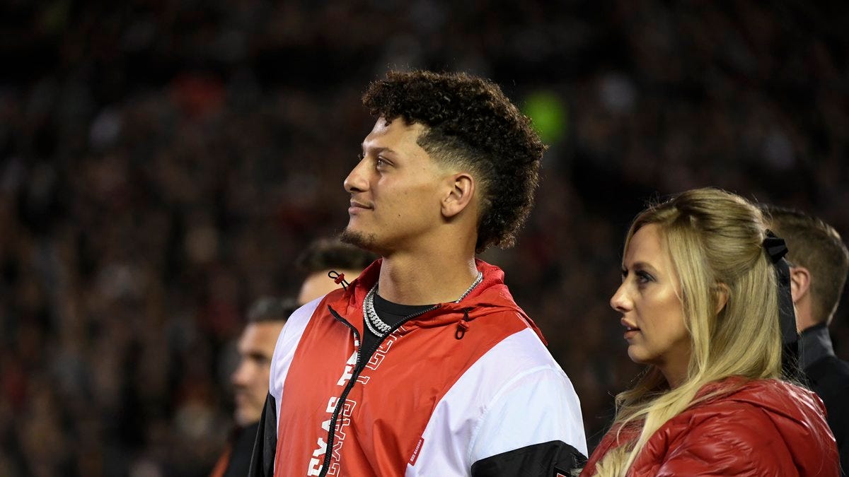 Former Texas Tech quarterback Patrick Mahomes stands with his wife Brittany Mahomes for his...