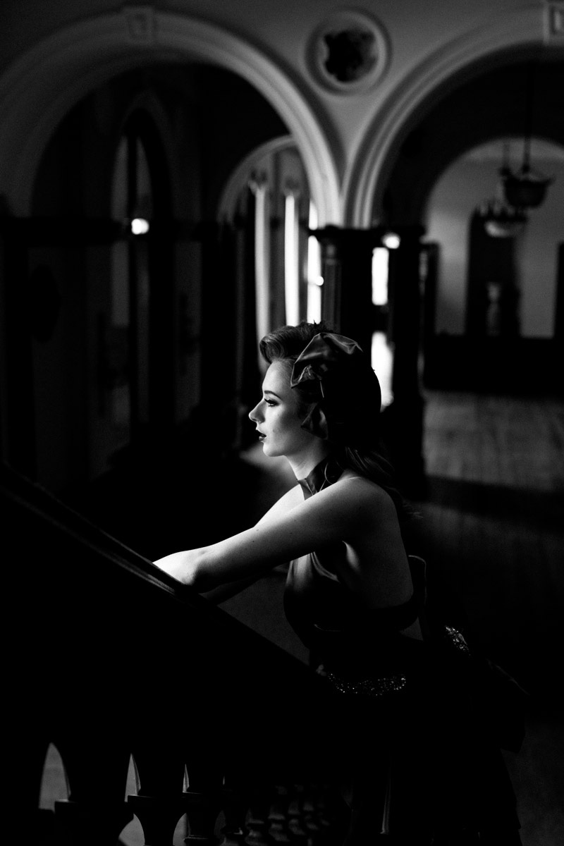 Black and white portrait of an elegant model in a stately home