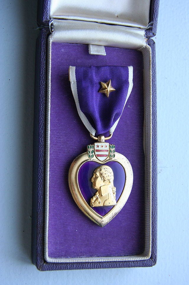 A purple heart medal in it's case