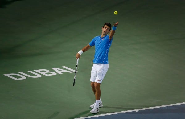 novak djokovic serving balls to borna coric dubai tennis 2015