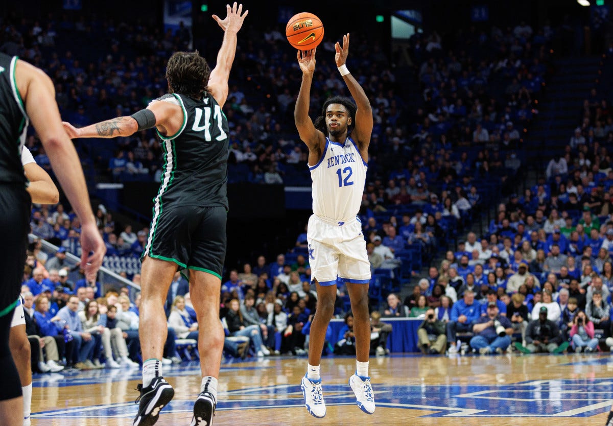 Nov 24, 2023; Lexington, Kentucky, USA; Kentucky Wildcats guard Antonio Reeves (12) shoots the ball during the second half against the Marshall Thundering Herd at Rupp Arena at Central Bank Center. Mandatory Credit: Jordan Prather-USA TODAY Sports