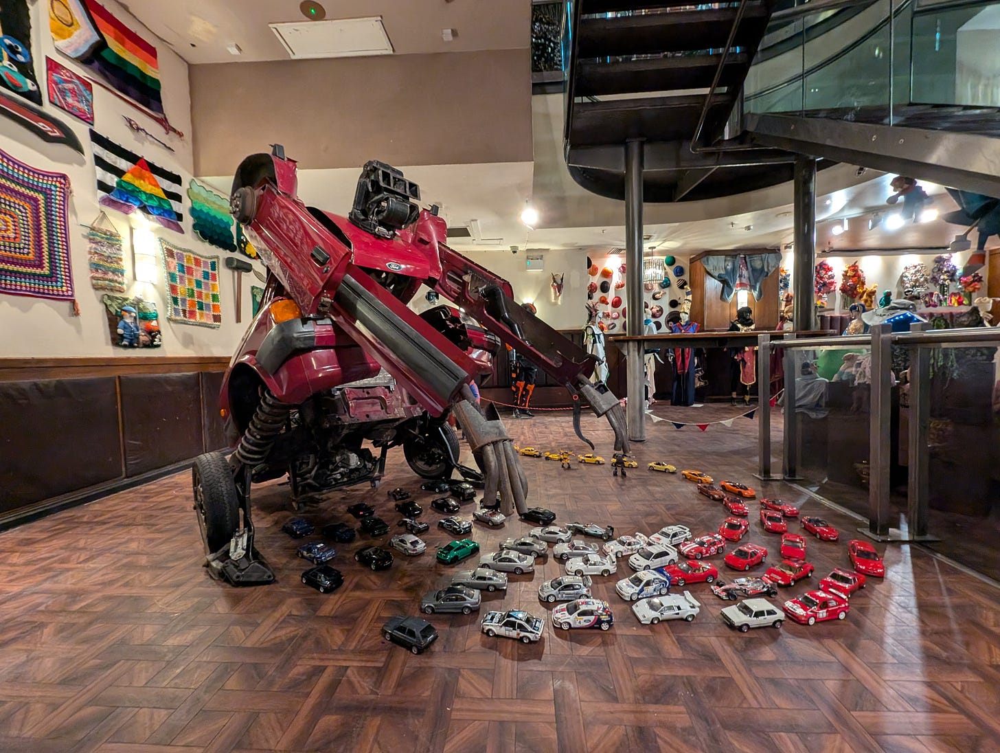 A transformer playing with toy cars