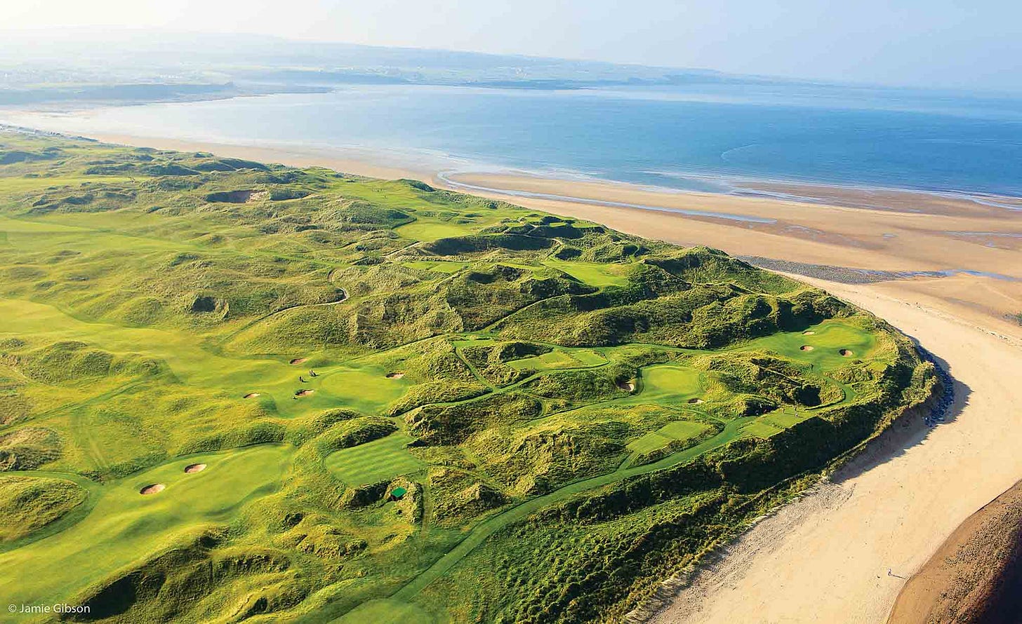 Evening view of Lahinch Golf Club's undulating links course with dramatic sand dunes in golden light. A historic Irish town with prominent church spire sits in the background against misty mountains, creating a quintessential Irish golf scene.Aerial view of Lahinch Golf Club showing emerald green fairways winding through natural sand dunes along a pristine beach. The dramatic Irish coastline stretches into the distance with turquoise waters meeting golden sand, while undulating links terrain creates a classic seaside golf landscape. Evening view of Lahinch Golf Club's undulating links course with dramatic sand dunes in golden light. A historic Irish town with prominent church spire sits in the background against misty mountains, creating a quintessential Irish golf scene.Aerial view of Lahinch Golf Club showing emerald green fairways winding through natural sand dunes along a pristine beach. The dramatic Irish coastline stretches into the distance with turquoise waters meeting golden sand, while undulating links terrain creates a classic seaside golf landscape.