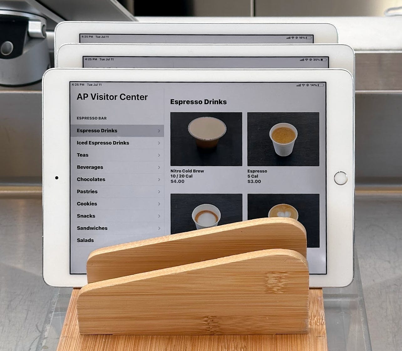 iPad menus display food and drink options at Apple Park Visitor Center.