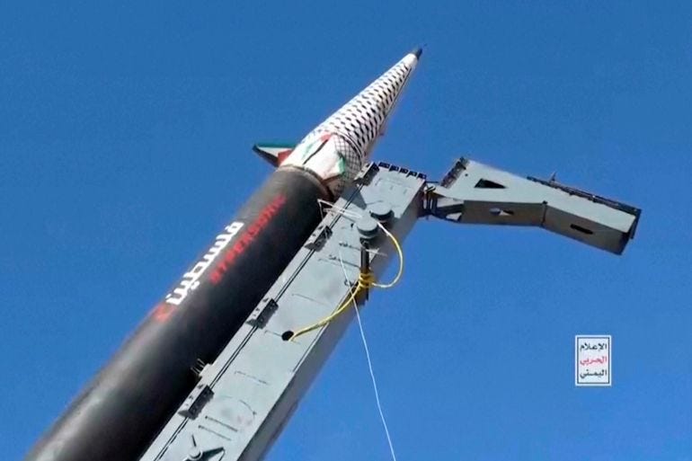 a missile against a blue sky