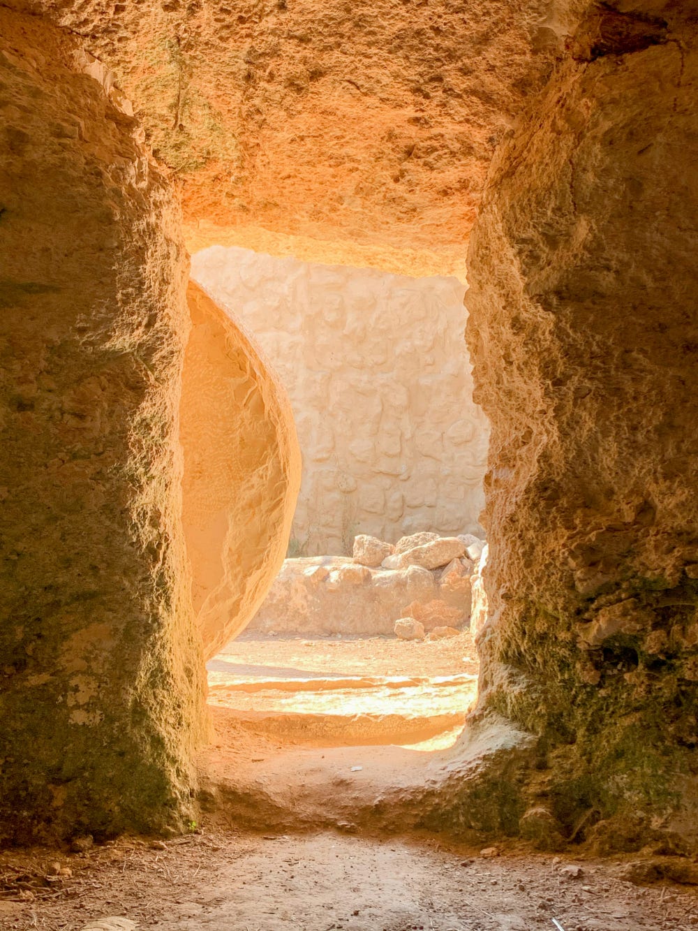 Ancient stone doorway with stone door pushed aside