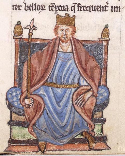 Miniature depiction of Henry II; the red-haired king is crowned and seated on a throne, adorned with a red and blue garment tied with a golden belt at the waist, holding a sceptre. Miniature depiction of Henry II; the red-haired king is crowned and seated on a throne, adorned with a red and blue garment tied with a golden belt at the waist, holding a sceptre.