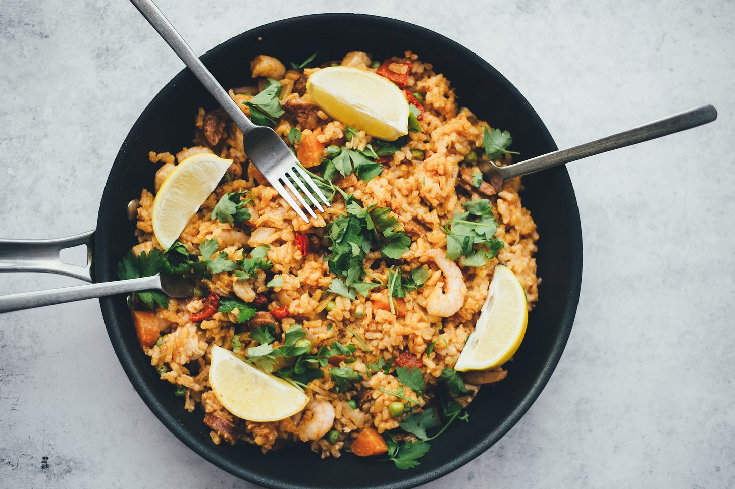 A bowl of fried rice. Foodies can add a twist to fried rice using seafood, veggies, and even regionally-inspired spices. | How to cook fried rice with recipes | Mania Food